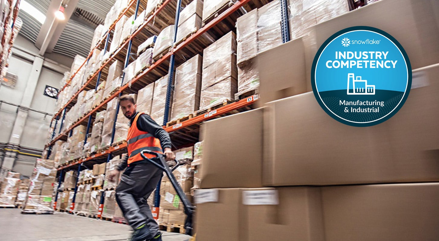 A warehouse worker in an orange safety vest moves boxes with a pallet jack. "Industry Competency: Manufacturing & Industrial" badge is displayed in the top right corner.