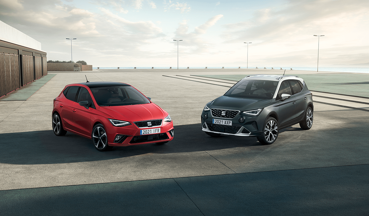 2 cars parked side-by-side, highlighting their unique styles and contemporary automotive design.