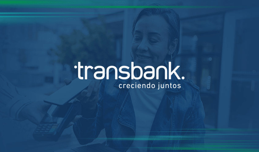 Transbank: creciendo juntos logo with an image of a woman using her mobile device to tap to pay on Transbank's POS system in the background.